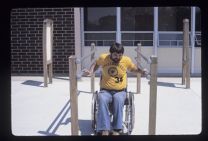 Man in wheelchair on campus